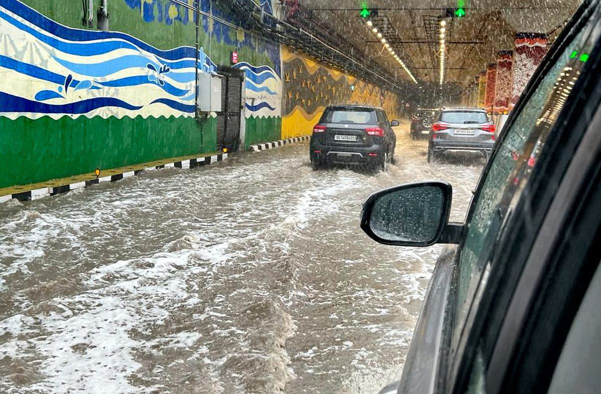 <div class="paragraphs"><p>Vehicles ply on a waterlogged road amid monsoon rains, near Pragati Maidan in New Delhi.</p></div>