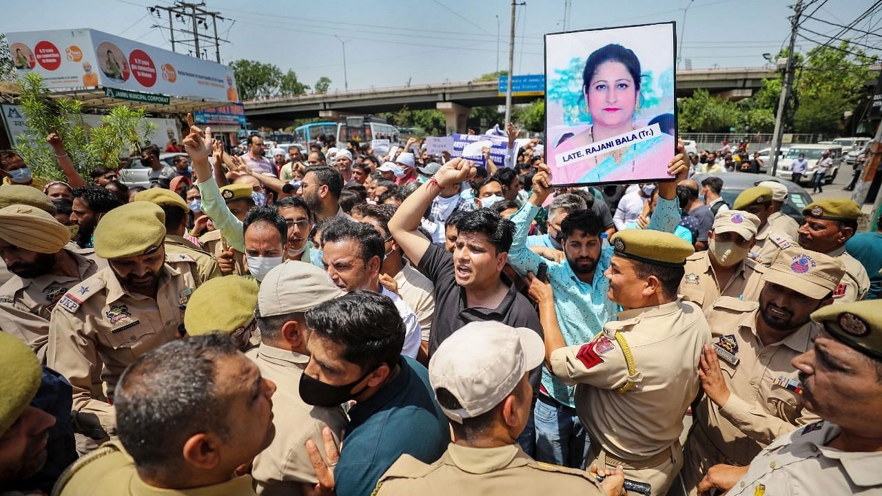 <div class="paragraphs"><p>Jammu: Police stop members of Jammu and Kashmir Teachers Association during a protest over the killing of government teacher Rajni Bala, in Jammu, Thursday, 2 June.</p></div>