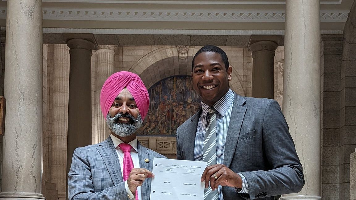 <div class="paragraphs"><p>Diljeet Singh Brar (left) introduced the bill. He is standing next to&nbsp;MLA Jamie Moses.</p></div>