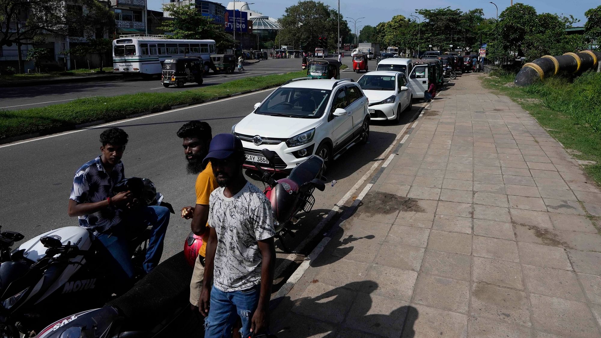 <div class="paragraphs"><p>Motorists wait in a queue expecting to buy fuel in Colombo, Sri Lanka on Sunday, 26 June.</p></div>
