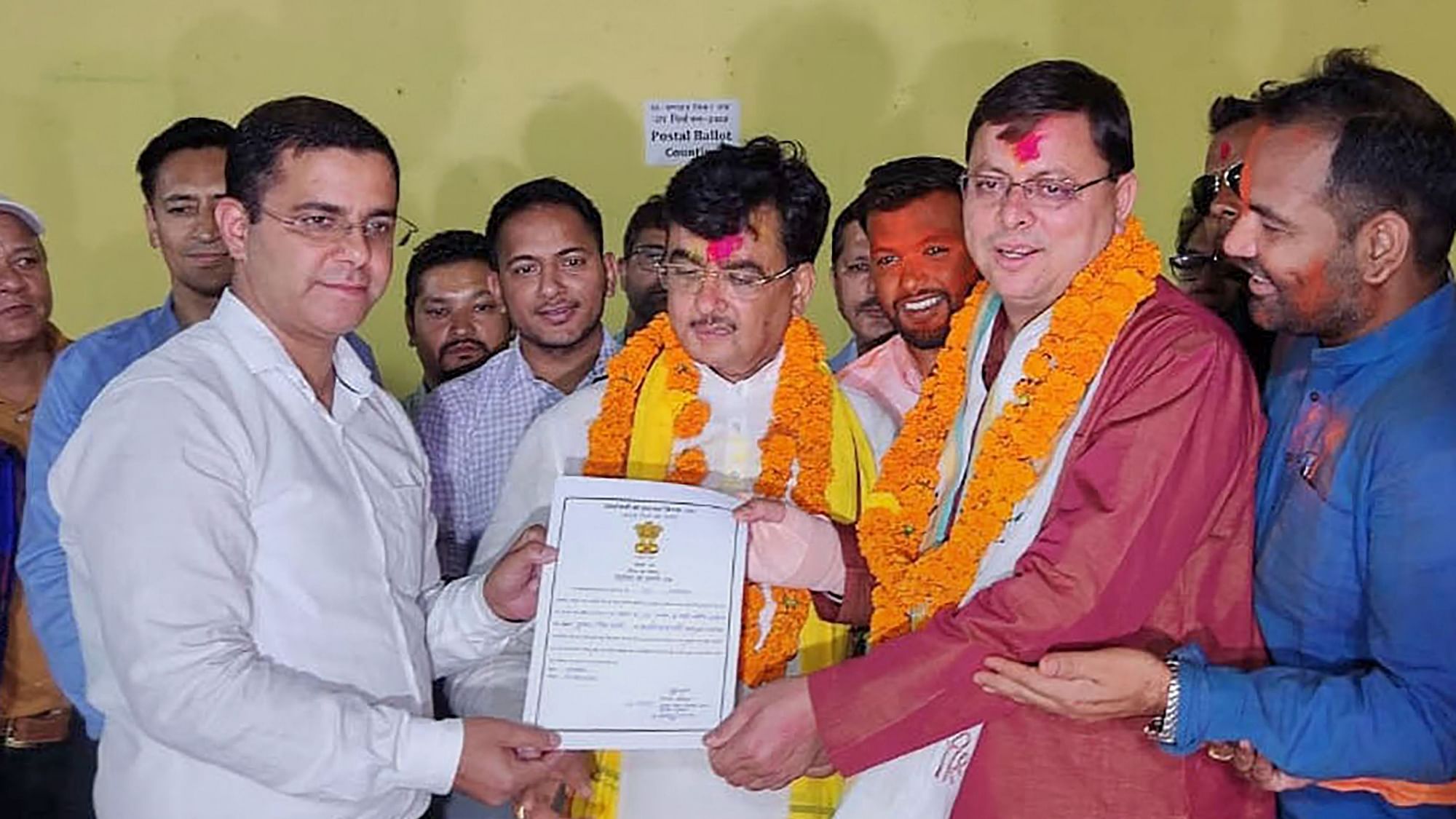<div class="paragraphs"><p>Uttarakhand Chief Minister Pushkar Singh Dhami receives the victory certificate after winning the Champawat Assembly by-election on Friday, 3 June, 2022.</p></div>