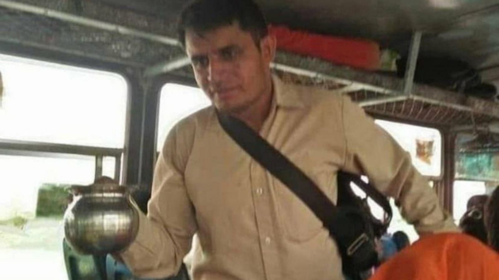 <div class="paragraphs"><p>Haryana bus conductor providing water to all passengers</p></div>