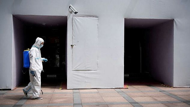 <div class="paragraphs"><p>A worker in a protective suit disinfecting the area following the outbreak in Shanghai. Image used for representation.</p></div>