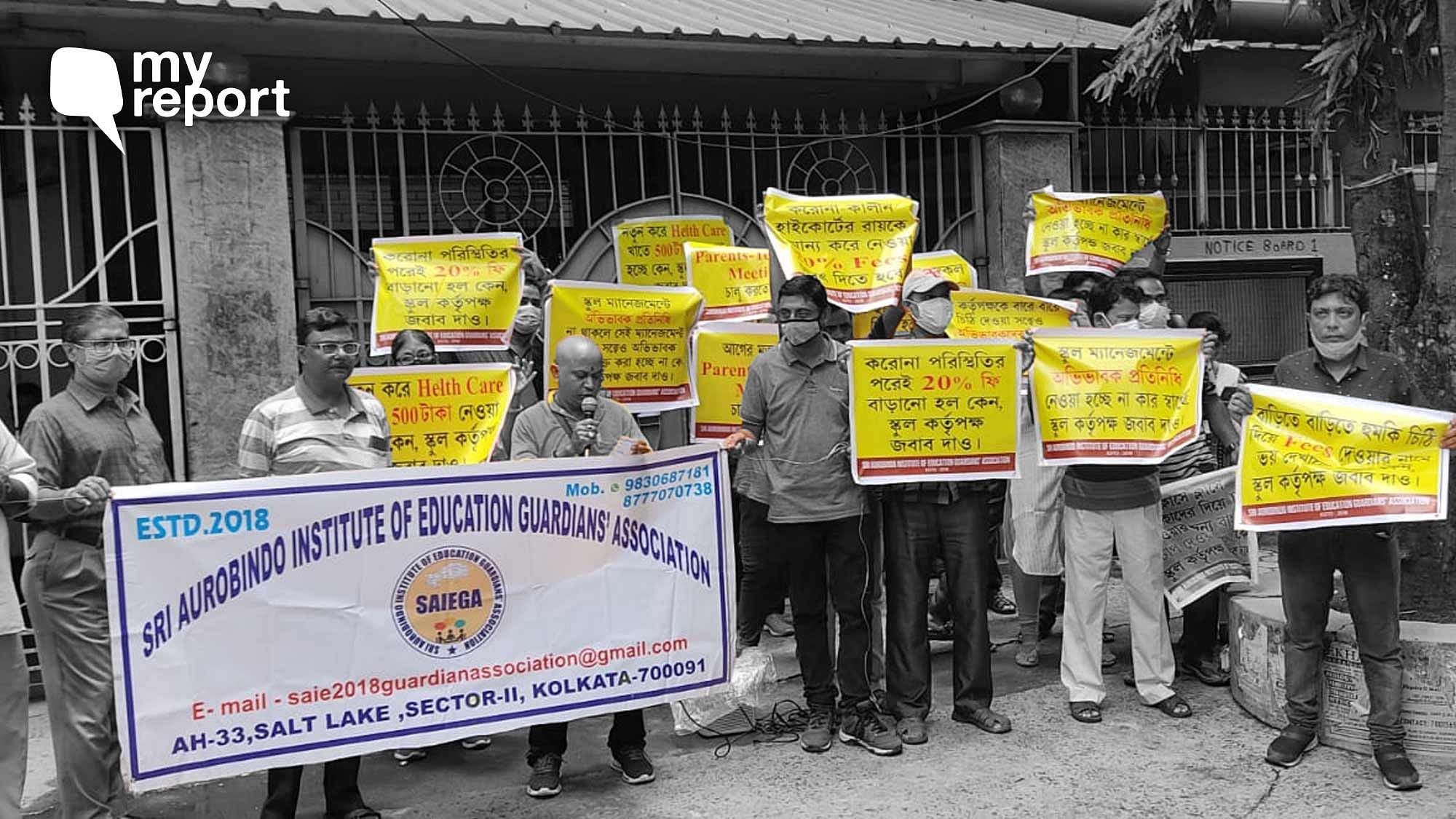 <div class="paragraphs"><p>Parents and guardians of Sri Aurobindo Institute of Education protesting outside the school in Kolkata</p></div>