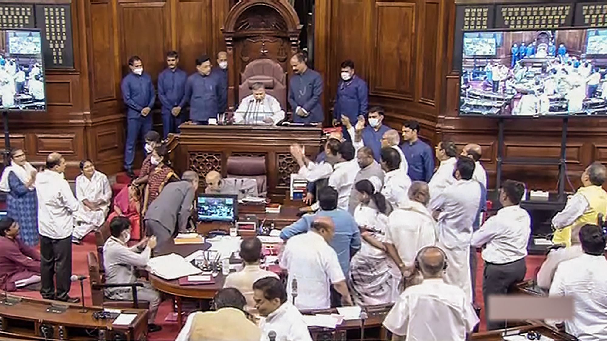 <div class="paragraphs"><p> Opposition members protest in the Rajya Sabha during ongoing Monsoon Session of Parliament, in New Delhi, Tuesday, 26 July.</p></div>