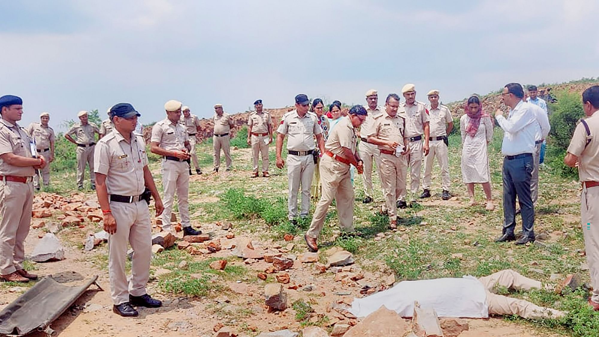 <div class="paragraphs"><p>Police personnel at the crime scene after DSP Surender Singh Bishnoi was allegedly mowed to death by the mining mafia at Pachgaon in Haryana's Nuh district on Tuesday, 19 July.&nbsp;</p></div>