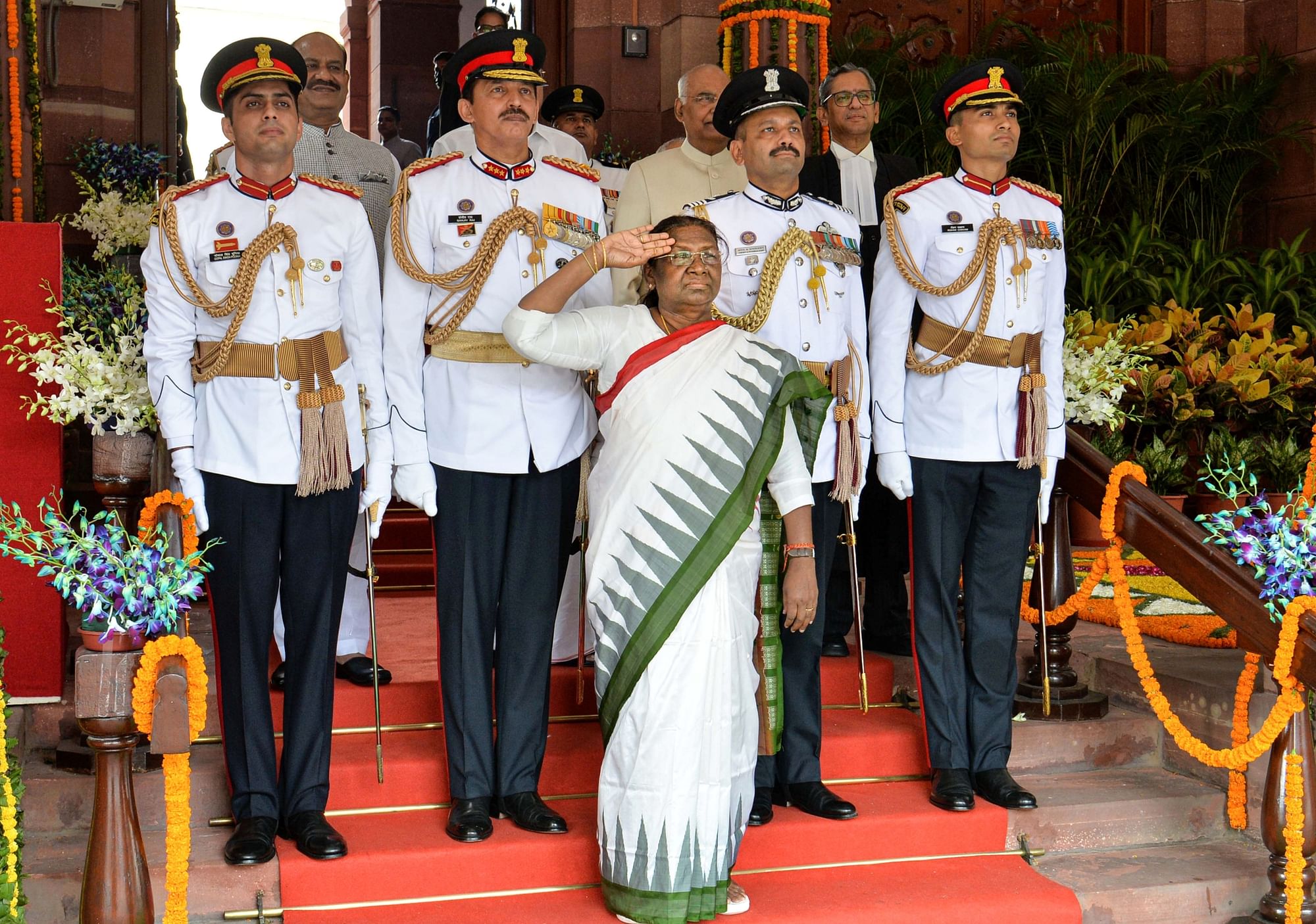 <div class="paragraphs"><p>President Droupadi Murmu  salutes as she leaves after her oath taking ceremony in the Central Hall of Parliament, in New Delhi on Monday, 25 July.</p></div>