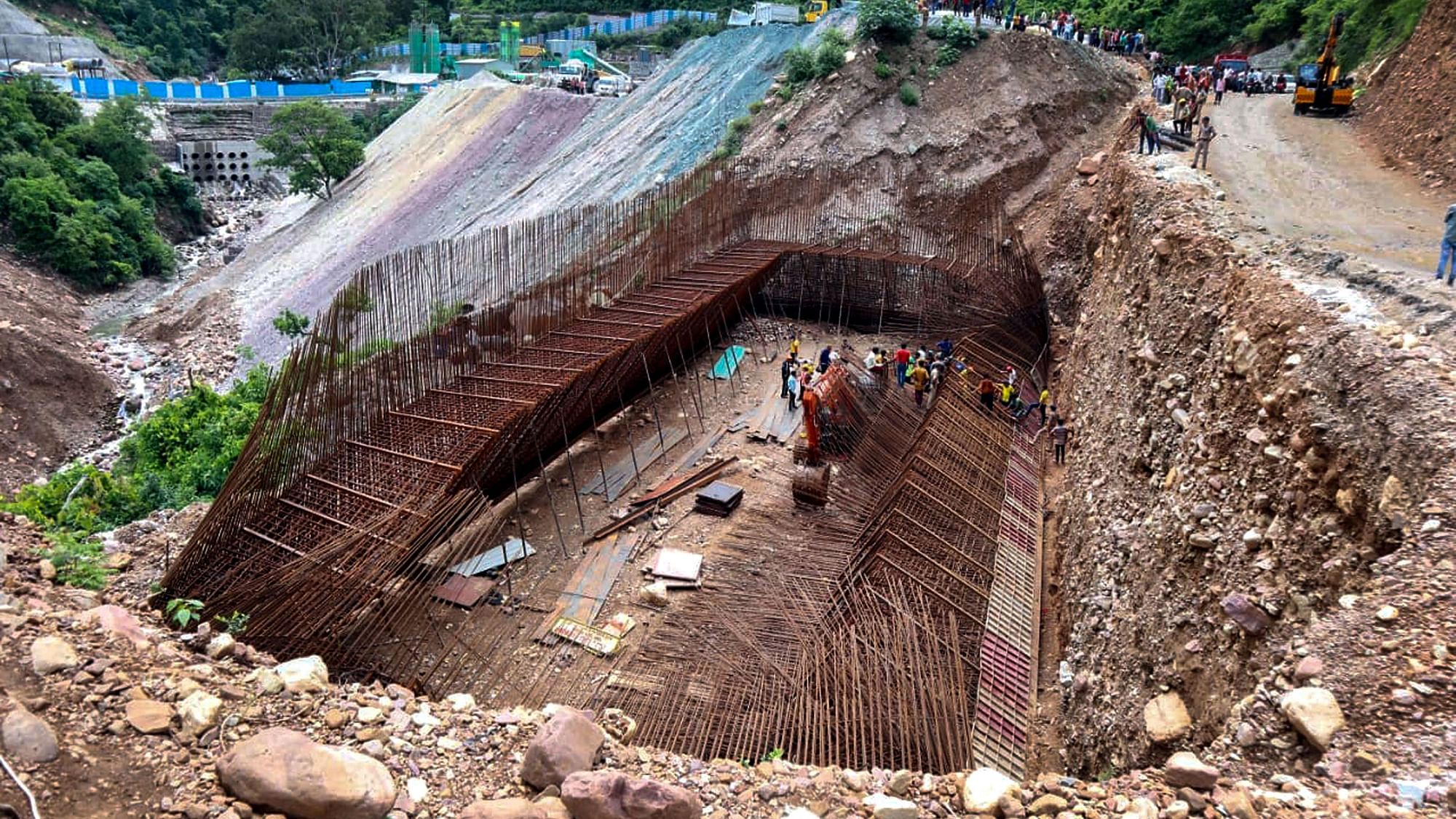 <div class="paragraphs"><p>Rescue operation underway after an iron shuttering of an under-construction bridge collapsed on Rishikesh-Badrinath highway, in Rudraprayag district, on Wednesday, 20 July.</p></div>