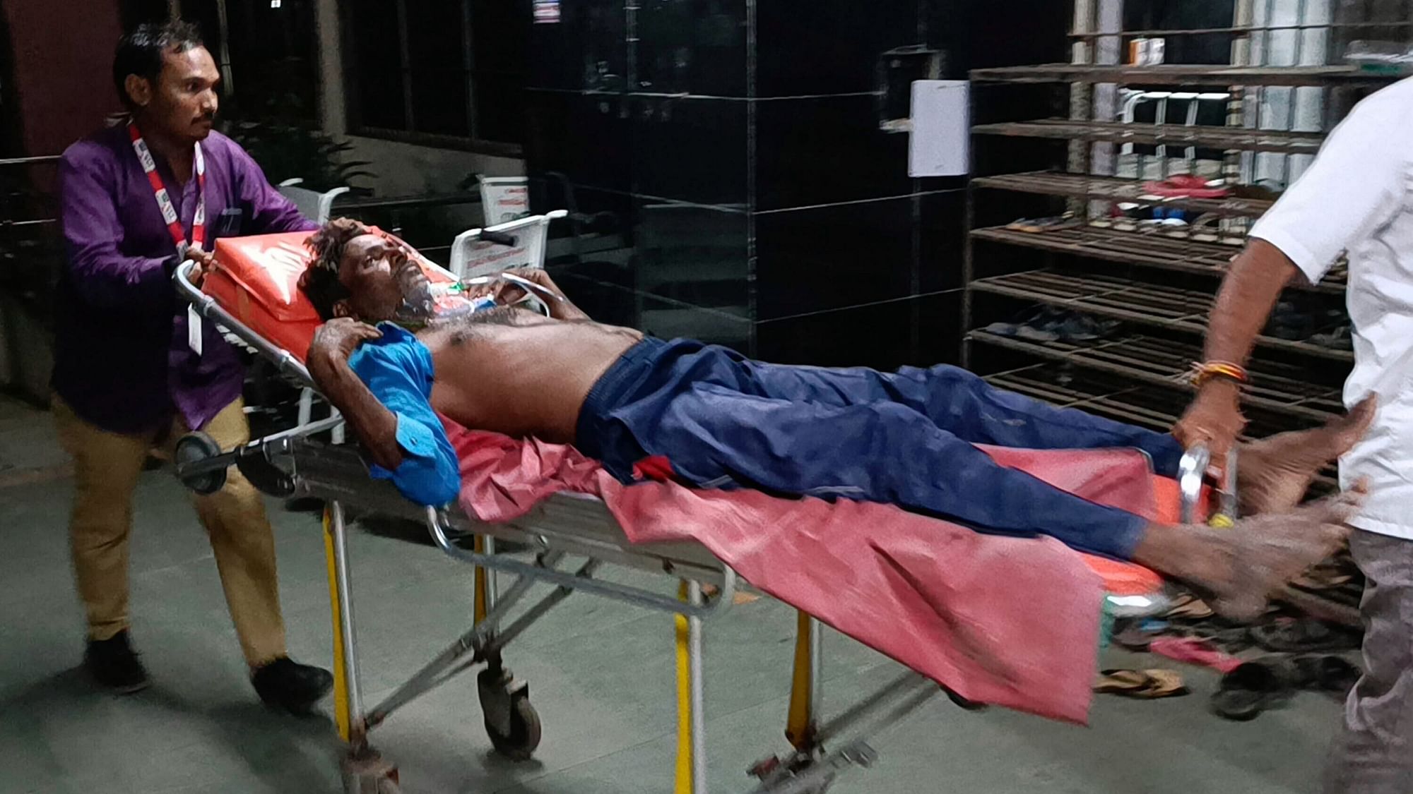 <div class="paragraphs"><p>A man is carried on a stretcher for treatment after falling sick from consuming spurious liquor in Botad, India, Tuesday, 26 July.</p></div>