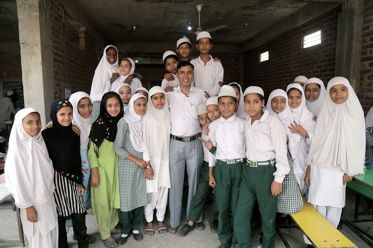 Ram Khiladi has been teaching Hindi at Madrasa Jamia Rashidia in Ghaziabad's Loni for the last 15 years.