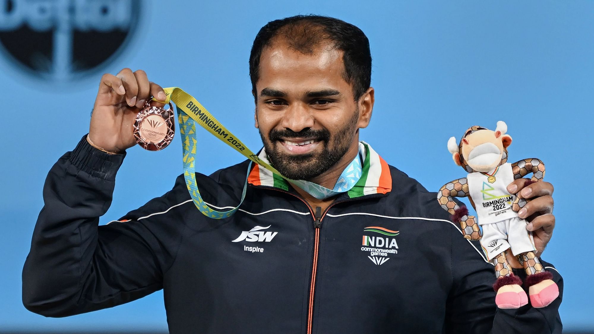 <div class="paragraphs"><p>Birmingham: India's Gururaja Poojary poses with the bronze medal after winning Men's 61kg Weightlifting category match of the Commonwealth Games 2022.</p></div>