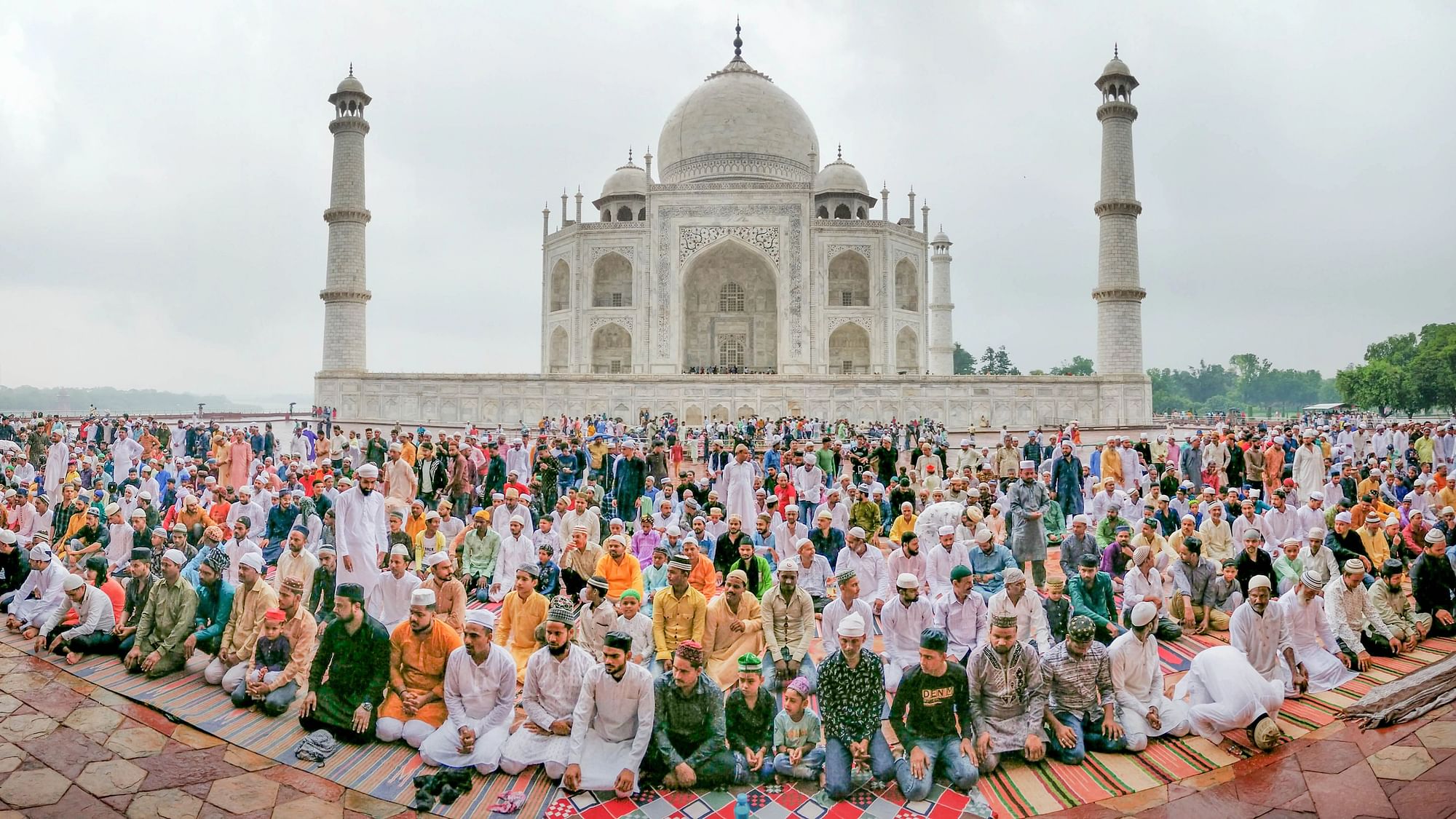 <div class="paragraphs"><p>Muslim devotees offer prayers on the occasion of Eid al-Adha at the Taj Mahal complex in Agra on Sunday, 10 July.</p></div>