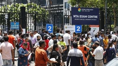<div class="paragraphs"><p>Family members wait outside as candidates appear for the National Testing Agency CUET-UG 2022 entrance exam at DU Sport complex in New Delhi on Friday July 15, 2022. </p></div>