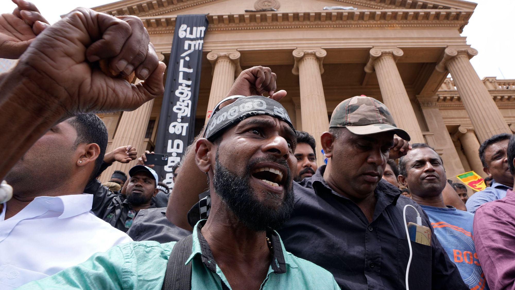 <div class="paragraphs"><p>Protesters shouted anti government slogans outside presidents office as the Parliament voted to elect the new president in Colombo, Sri Lanka, Wednesday, July 20, 2022.</p></div>