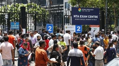 <div class="paragraphs"><p>Family members wait outside as candidates appear for the  CUET UG 2022 entrance exam at the DU Sports complex in New Delhi.&nbsp;</p></div>