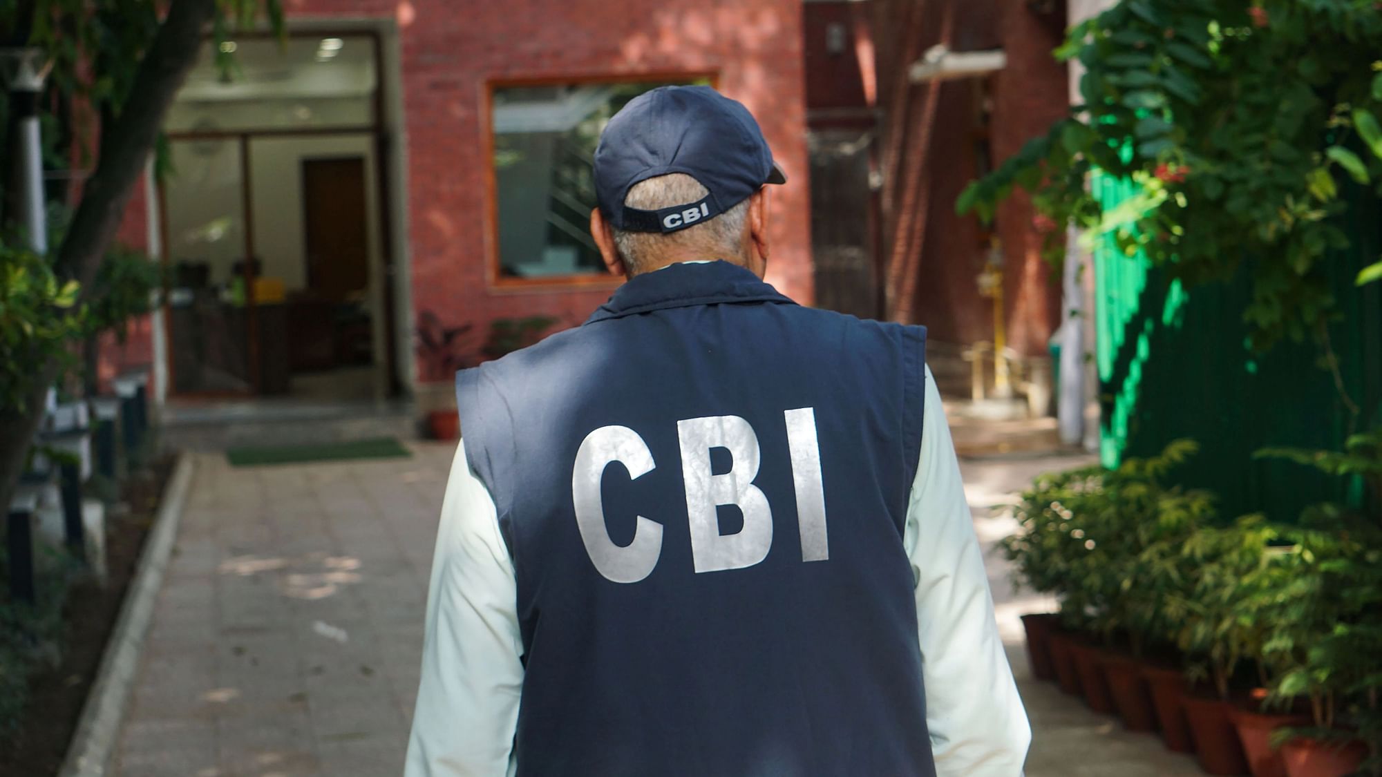 <div class="paragraphs"><p>A Central Bureau of Investigation (CBI) official during a raid at the residence of Delhi Deputy Chief Minister Manish Sisodia in connection with alleged irregularities in Delhi Excise Policy, in New Delhi, Friday, Aug. 19, 2022. The CBI carried out searches at over 10 locations in Delhi-NCR.</p></div>