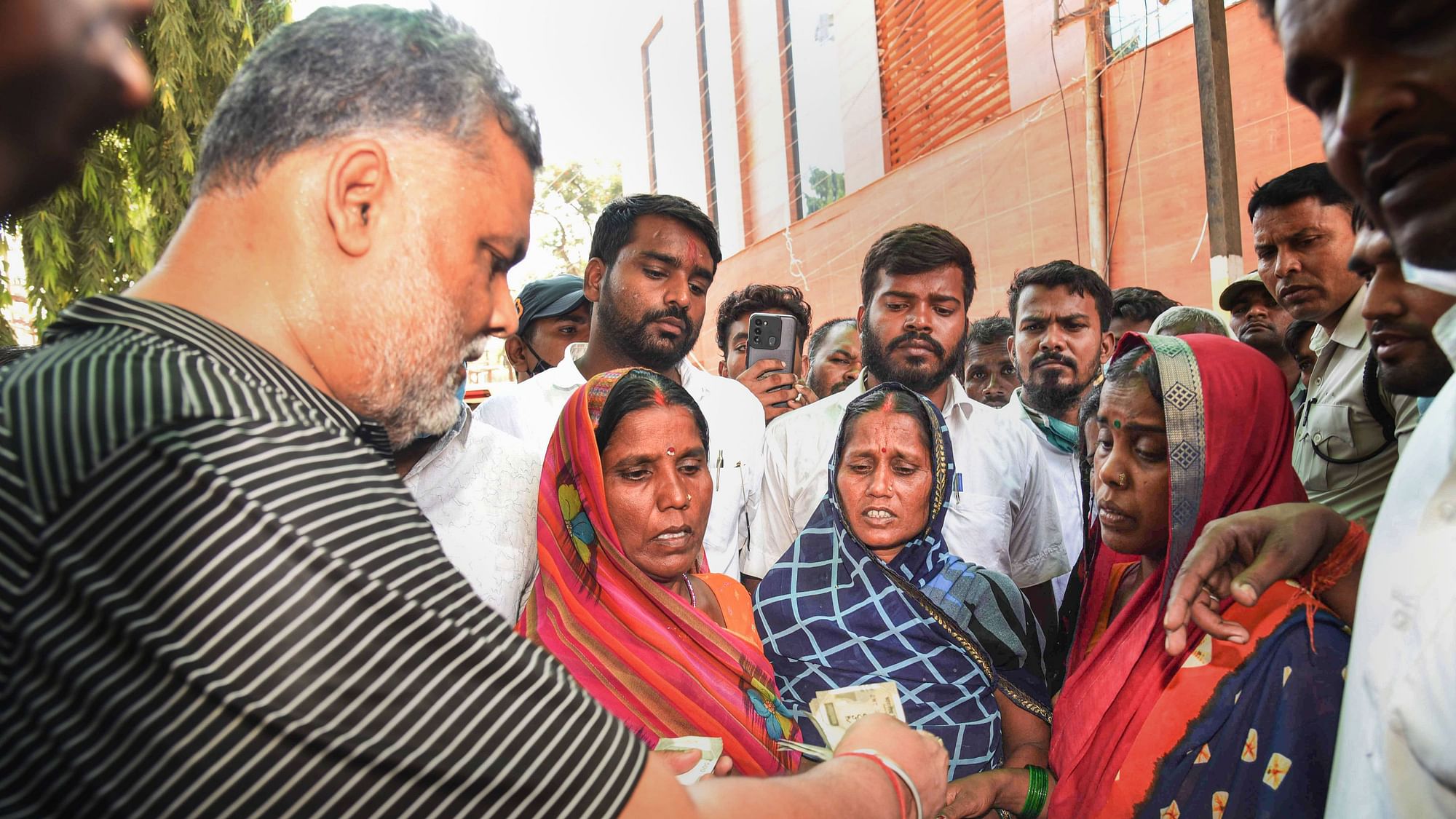 <div class="paragraphs"><p>Jan Adhikar Party President Pappu Yadav meets family members of victims, after several people died from allegedly consuming spurious liquor in Saran district of Bihar, in Patna, Friday, Aug 05, 2022.</p></div>