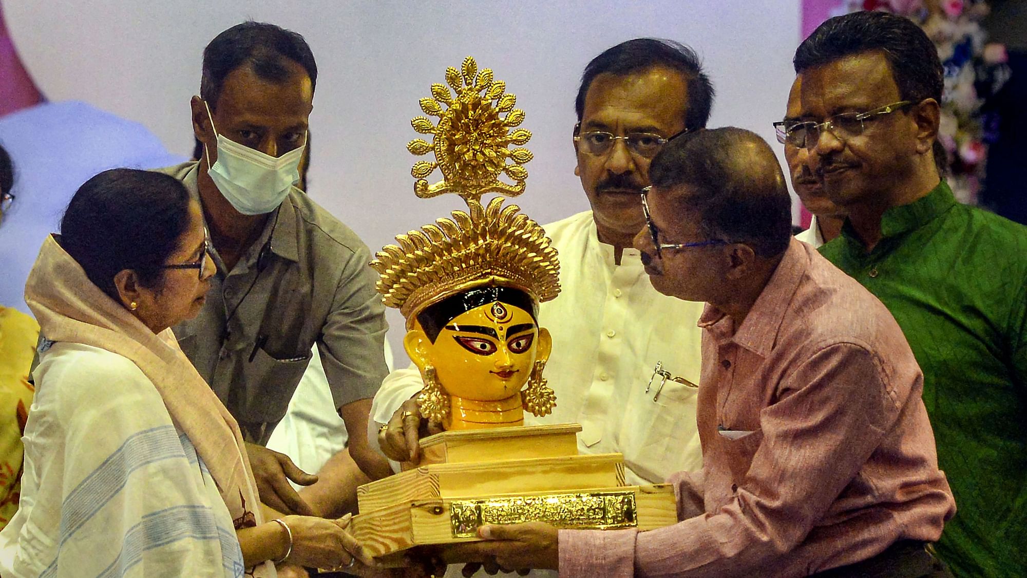 <div class="paragraphs"><p>West Bengal Chief Minister Mamata Banerjee being presented a bust of Goddess Durga during a coordination meeting with the organisers of Community Durga Puja, in Kolkata, on Monday, 22 August.</p></div>