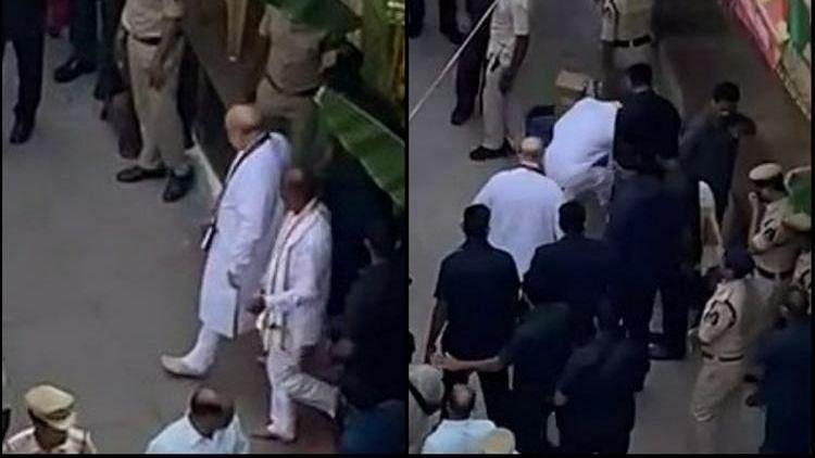 <div class="paragraphs"><p>As Amit Shah walked out after visiting the Ujjaini Mahakali Temple, a video clip showed Bandi Sanjay rushing ahead to pick up Shah’s footwear with his hands and placing them in front of his feet.</p></div>