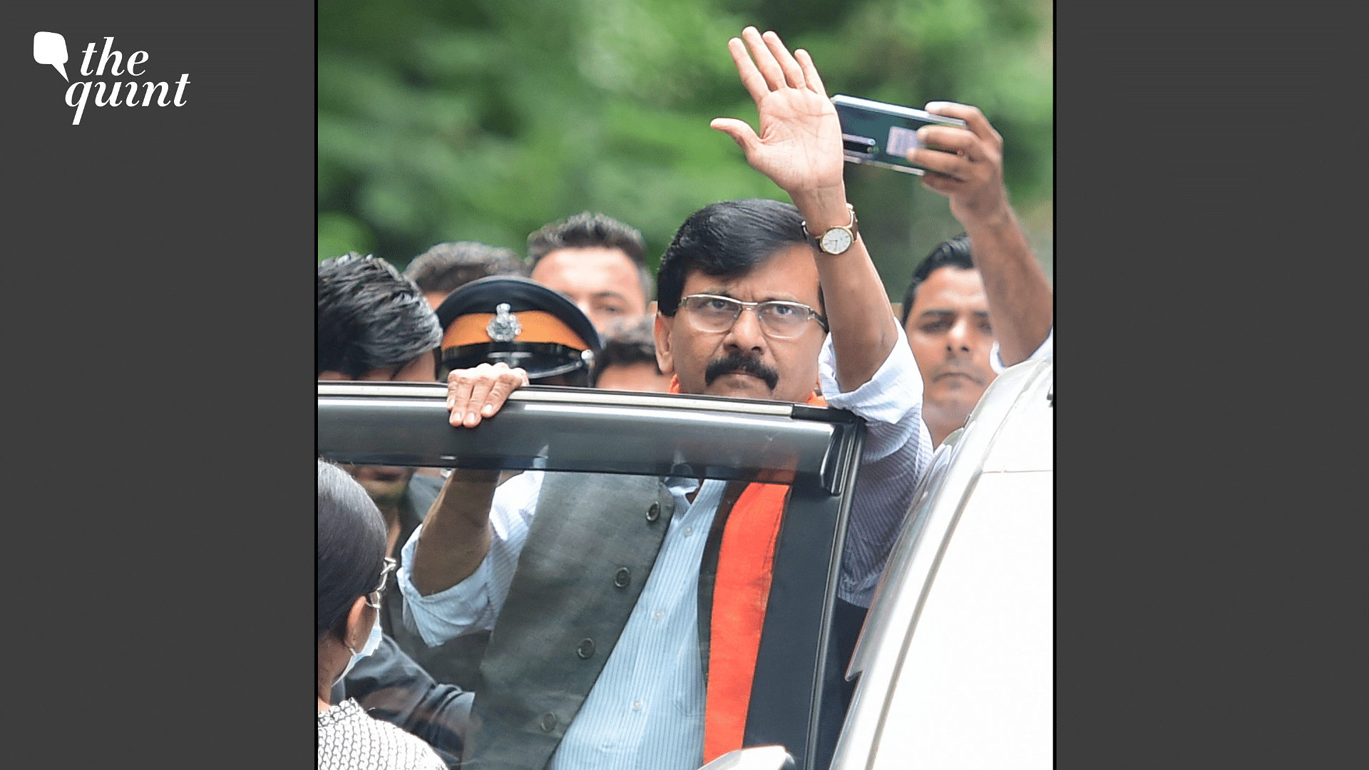 <div class="paragraphs"><p>Shiv Sena MP Sanjay Raut waves to his supporters while being produced in a special court in connection with a money laundering case, in Mumbai, Thursday, 4 August.</p></div>