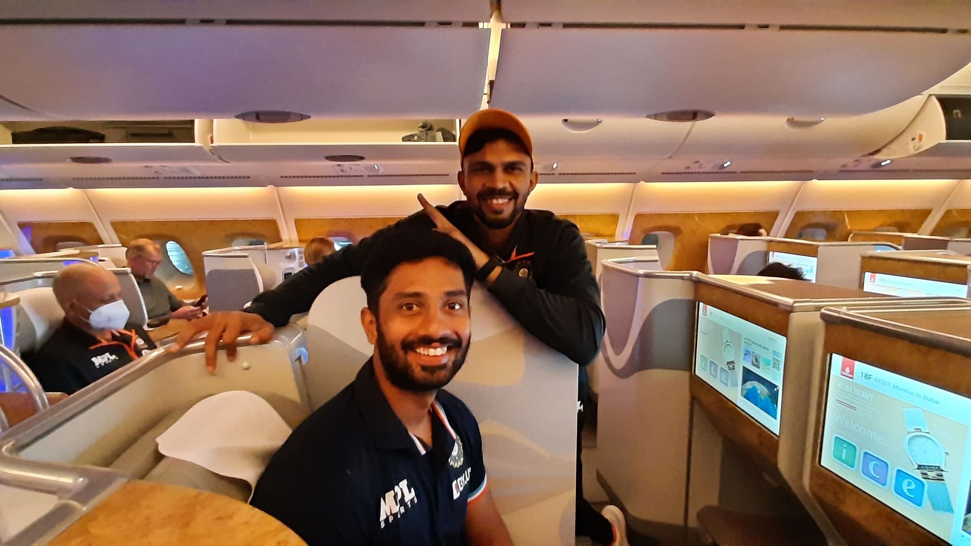 <div class="paragraphs"><p>Indian cricketers Ruturaj Gaikwad and Rahul Tripathi pose for photos during their flight to Zimbabwe ahead of the three-match ODI series.&nbsp;</p></div>