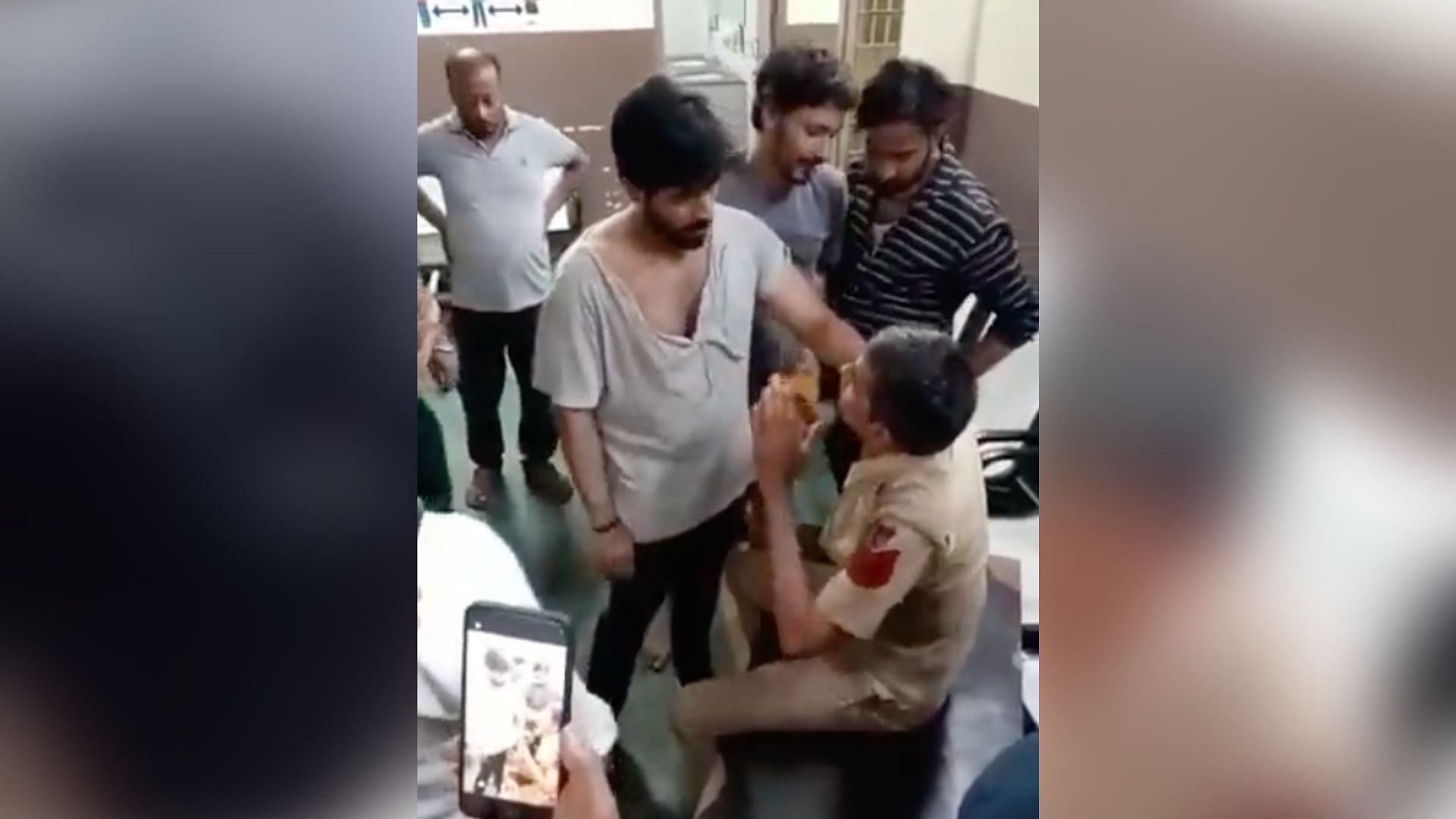 <div class="paragraphs"><p>The video shows head constable Prakash surrounded by people.</p></div>