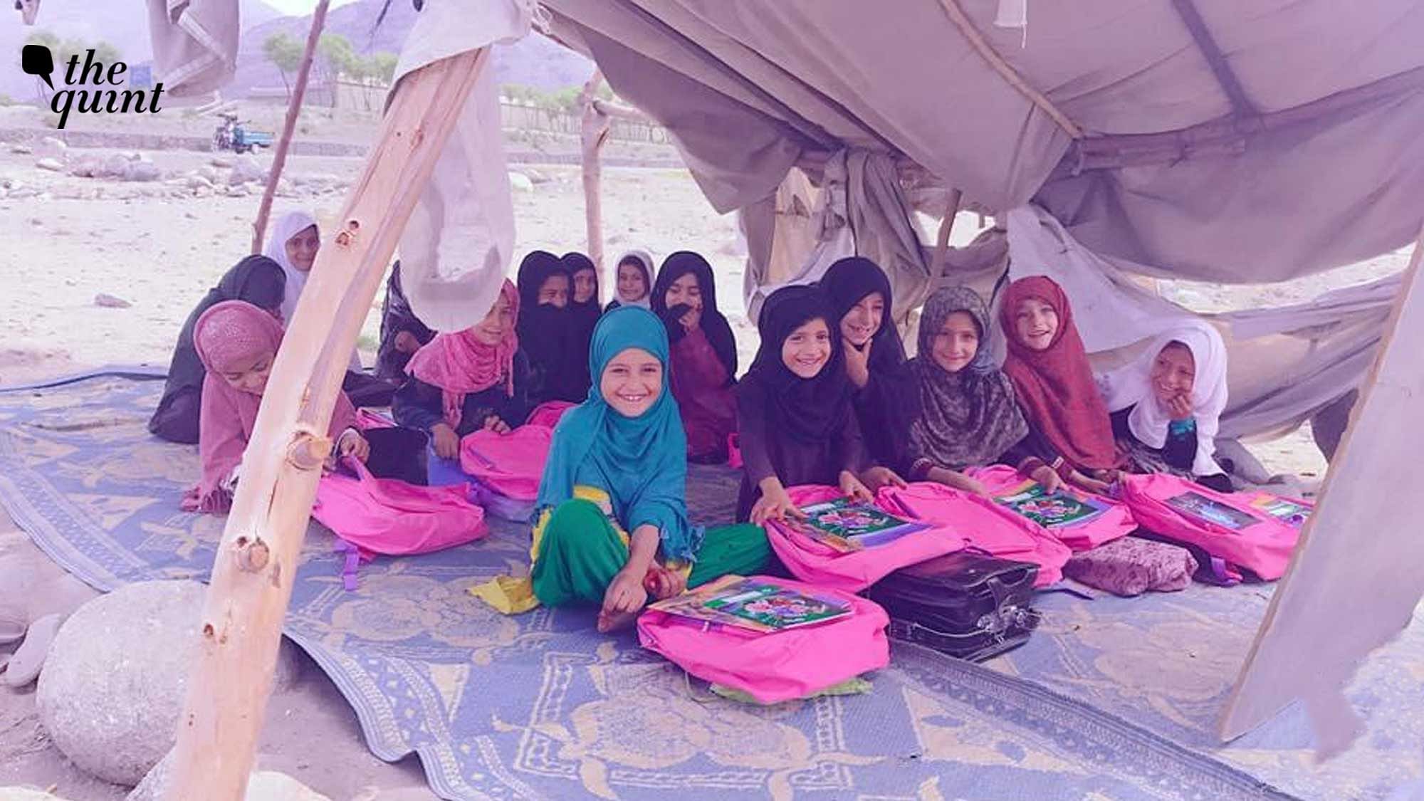 <div class="paragraphs"><p>Afghan girls smiling for a picture in one of Afghanistan's 'secret schools'.</p></div>