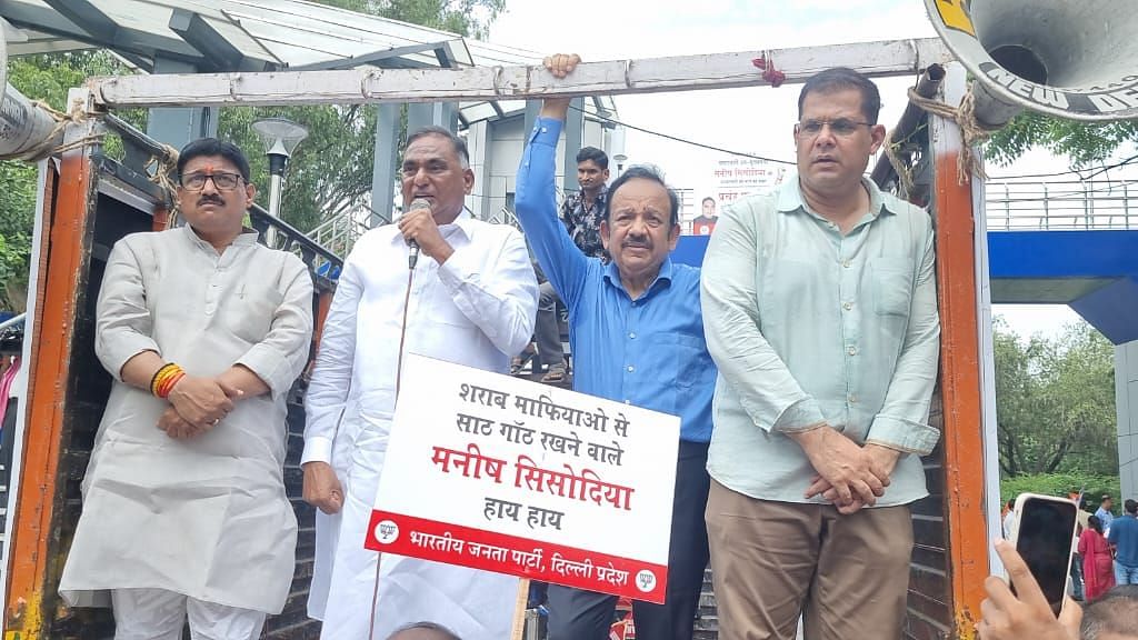 <div class="paragraphs"><p>BJP workers, led by MP Dr Harsh Vardhan, launched a protest against the Aam Aadmi Party and Delhi Deputy Chief Minister Manish Sisodia on Monday, 22 August, outside CM Arvind Kejriwal's residence in Delhi.</p></div>