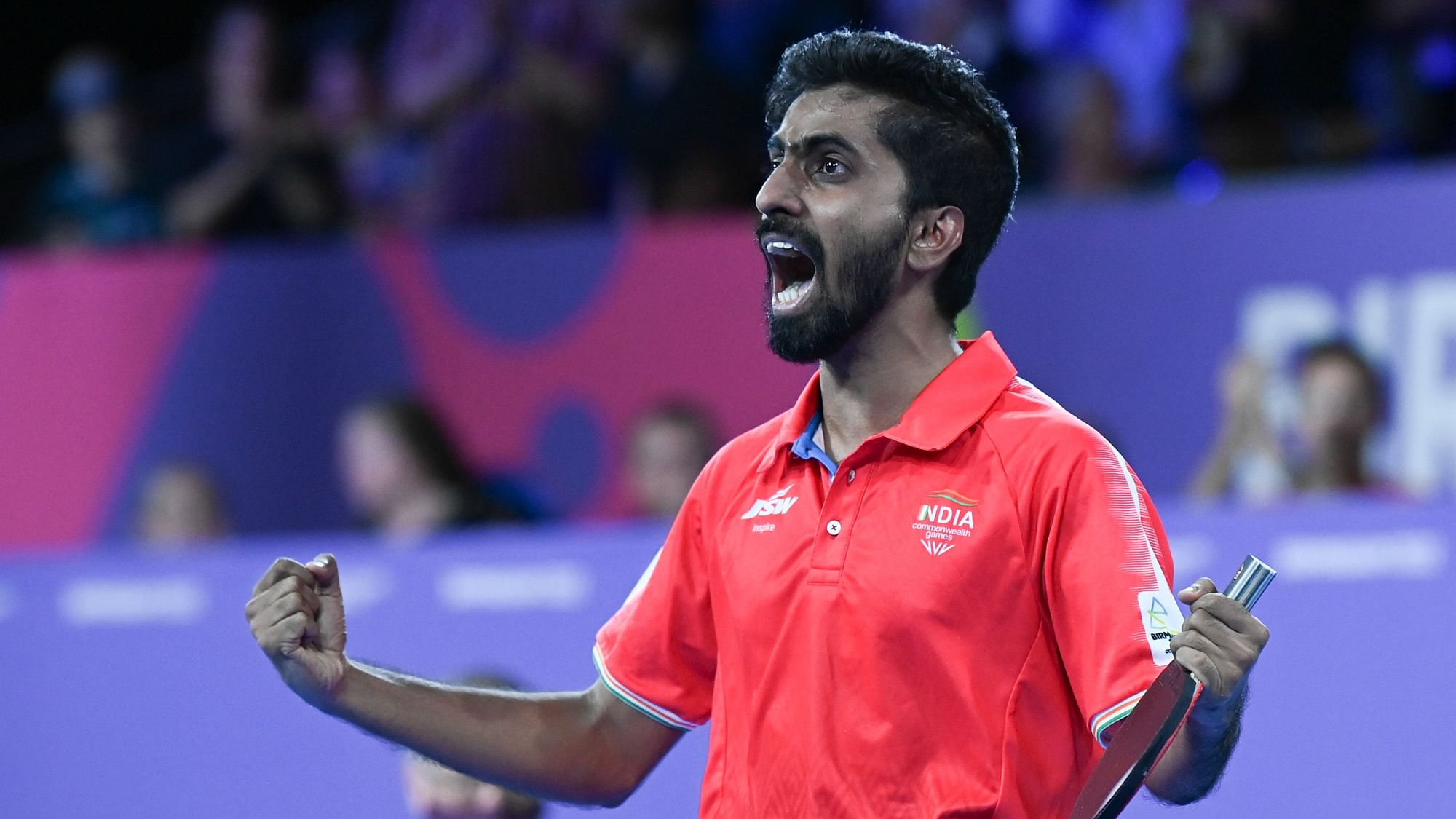 <div class="paragraphs"><p>Sathiyan Gnanasekaran of India reacts after defeating Paul Drinkhall of England in their men's singles table tennis bronze medal match at the 2022 CWG.</p></div>