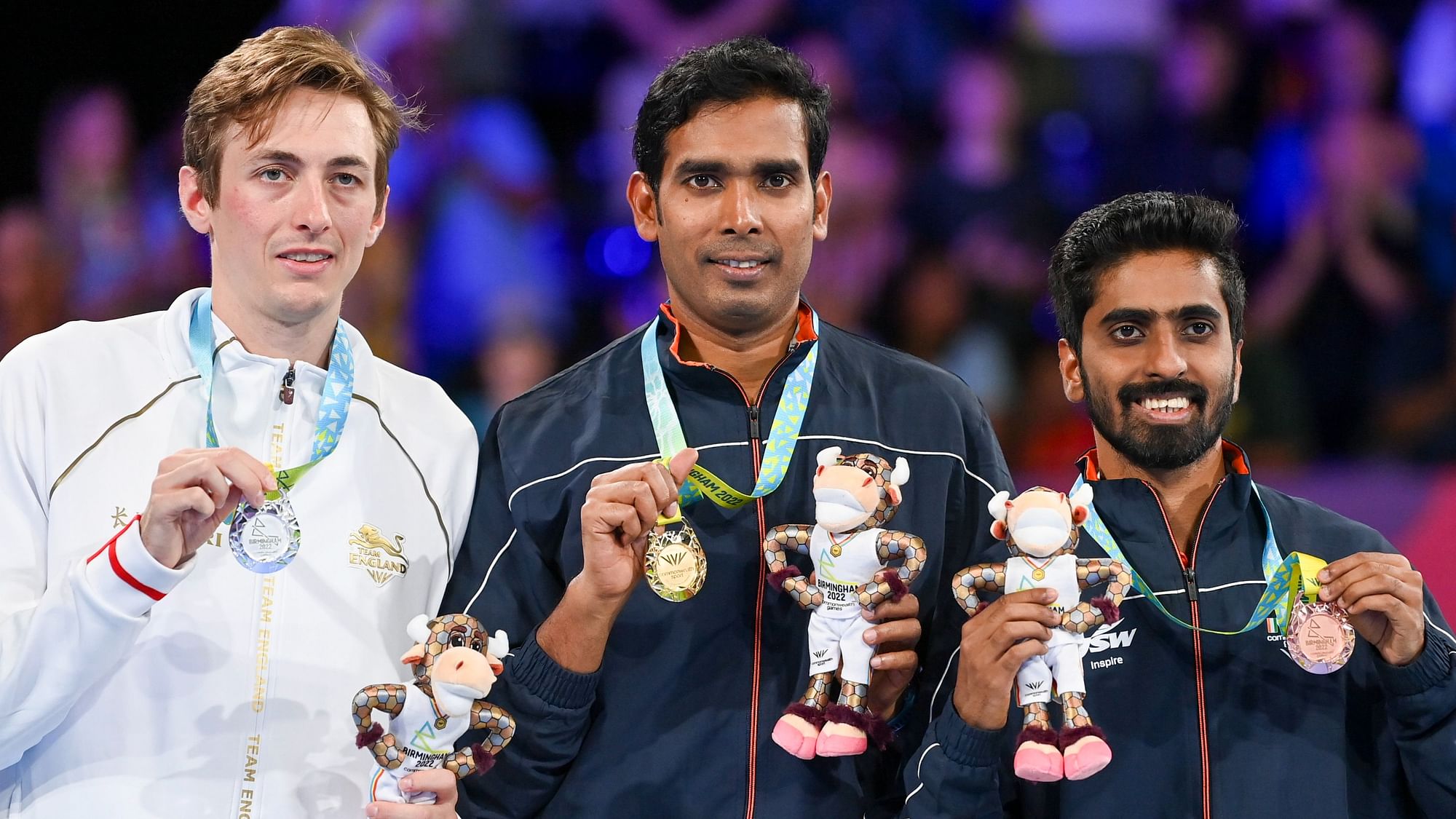 <div class="paragraphs"><p>Men's table tennis singles gold medalist,&nbsp;Achanta Sharath Kamal stands with silver medalist, Liam Pitchford of England, left, and bronze medalist Sathiyan Gnanasekaran during the 2022 CWG.</p></div>