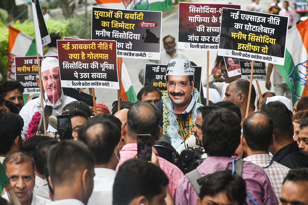 <div class="paragraphs"><p>Congress workers hold placards during their protest demanding resignation of Delhi Deputy Chief Minister Manish Sisodia, outside the AAP's office in New Delhi.</p></div>