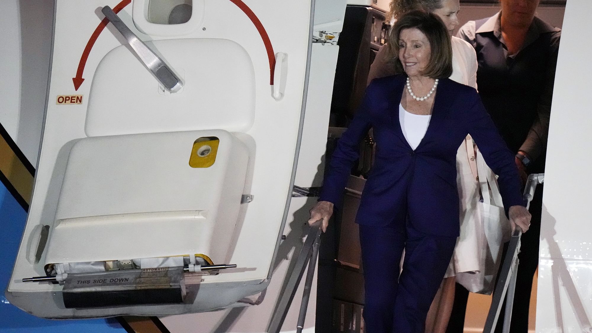 <div class="paragraphs"><p>US House Speaker Nancy Pelosi disembarks from a government plane at the US Yokota Air Base in Fussa on the outskirts of Tokyo on Thursday, 4 August. </p></div>