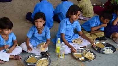 <div class="paragraphs"><p>Students having midday meals in a government school.&nbsp;</p></div>