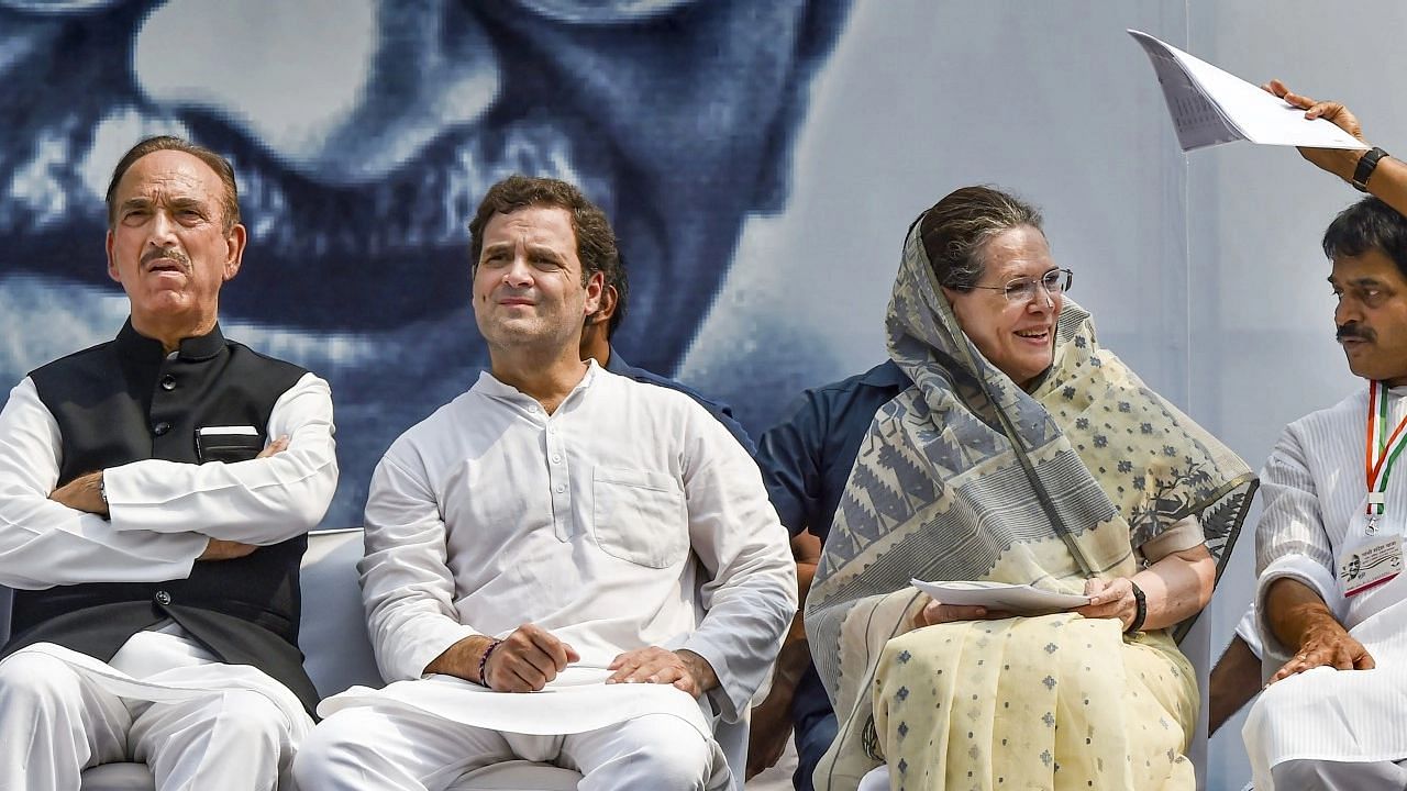 <div class="paragraphs"><p>Ghulam Nabi Azad with Sonia Gandhi and Rahul Gandhi</p></div>