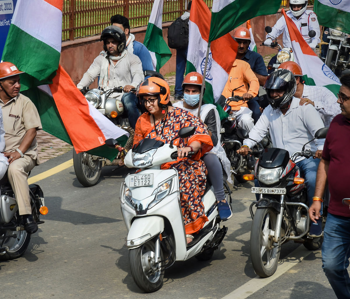 <div class="paragraphs"><p>Union Minister Smriti Irani rides a scooter during a Tiranga Bike Rally, flagged by Vice President M Venkaiah Naidu for the MPs of all parties, at Red Fort in old Delhi, Wednesday morning,  3&nbsp;August.</p></div>