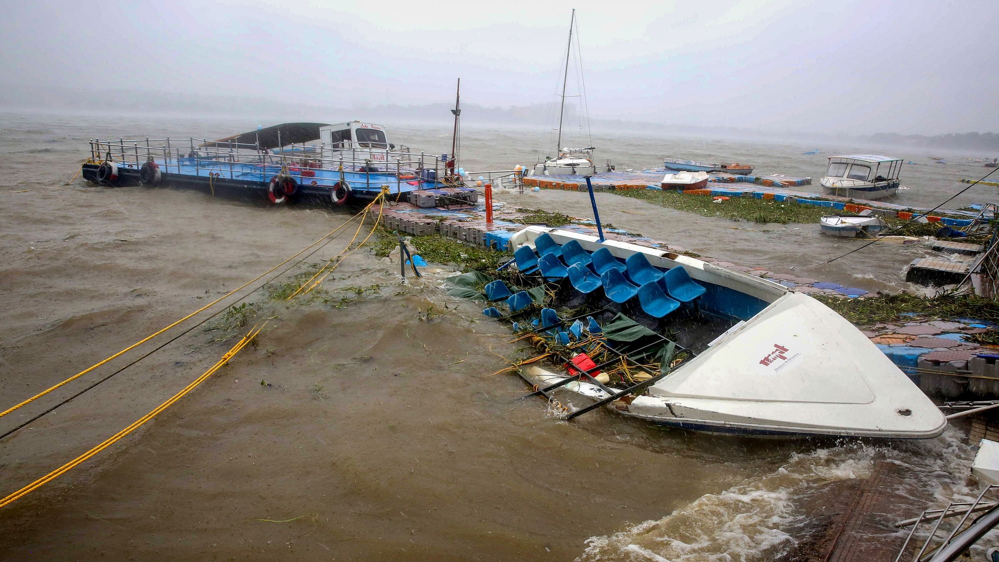 <div class="paragraphs"><p>Bhopal: A partially submerged cruise boat and damaged jetty after rains in Bhopal, on Monday, 22 August.</p></div>