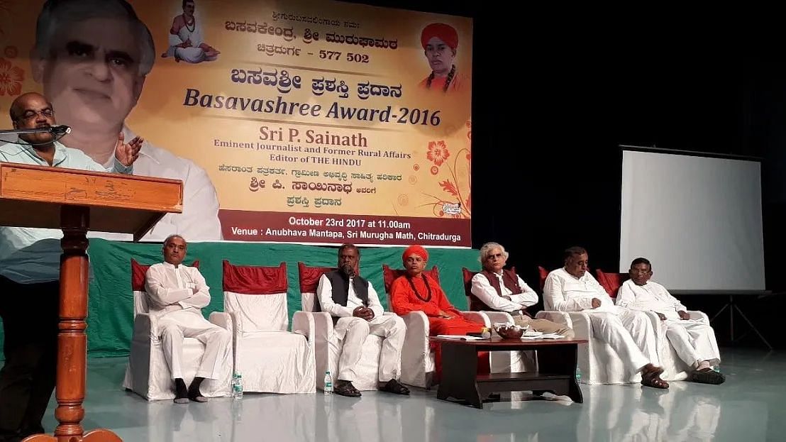 <div class="paragraphs"><p>P Sainath being conferred Basavashree award in 2016 by Murugha Mutt in Chitradurga.</p></div>