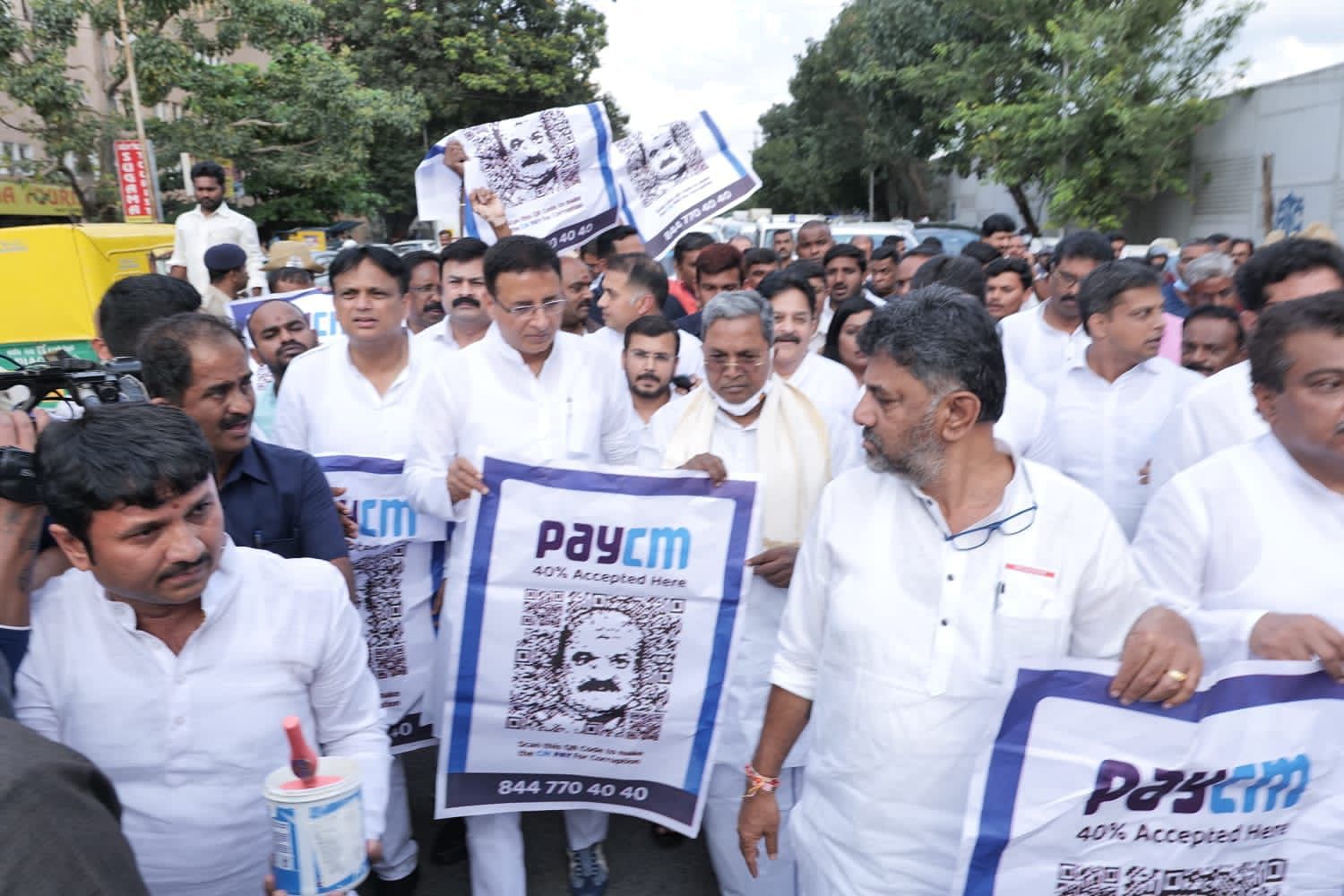 <div class="paragraphs"><p>LoP Siddaramaiah, Karnataka Congress Chief DK Shivakumar and party national spokesperson Randeep Singh Surjewala seen marching with 'PayCM' posters.&nbsp;</p></div>
