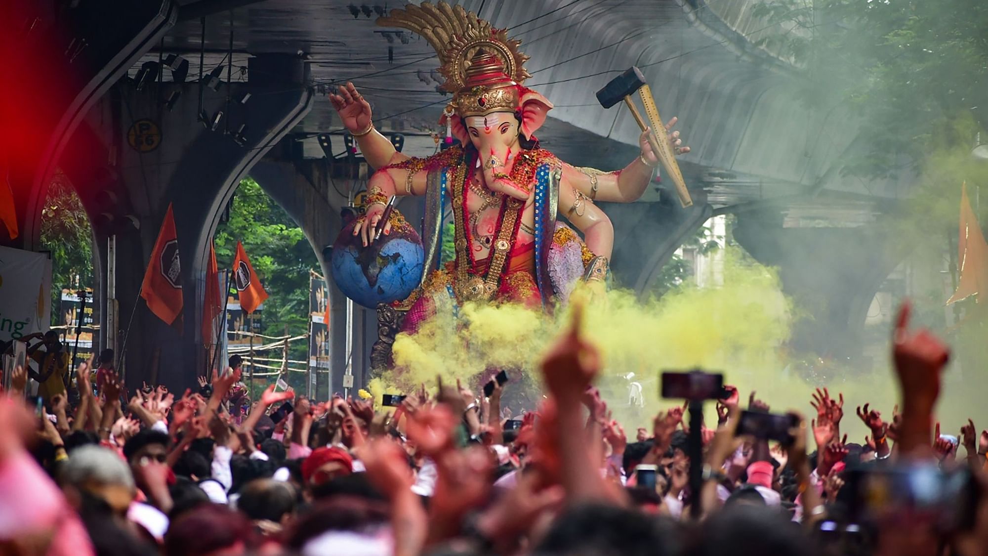 <div class="paragraphs"><p>Devotees revel in front of an idol of Lord Ganesha during an immersion procession in Mumbai on Friday, 9 September.</p></div>