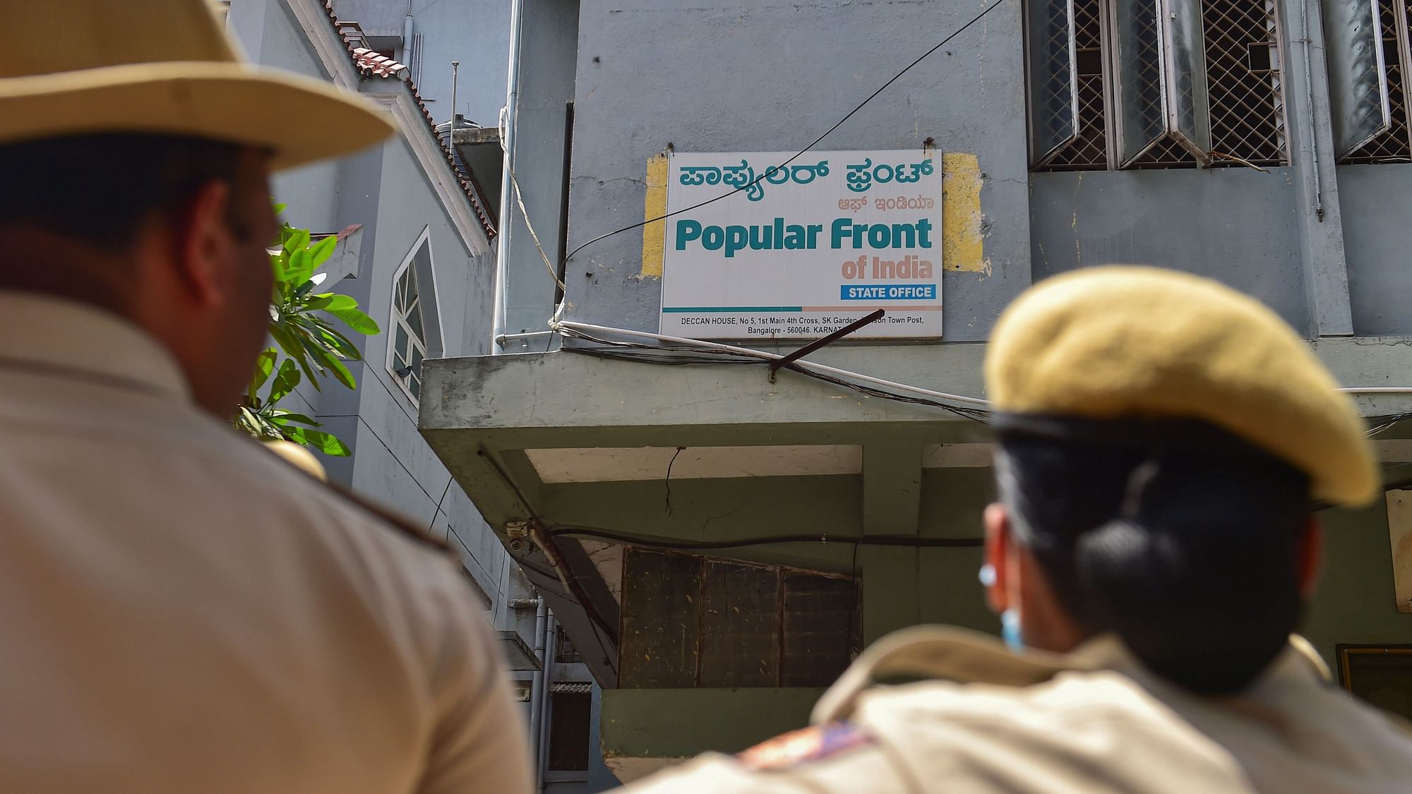 <div class="paragraphs"><p>Security personnel keep vigil outside the Popular Front of India (PFI) party office in Bengaluru, Thursday, on 22 September.</p></div>