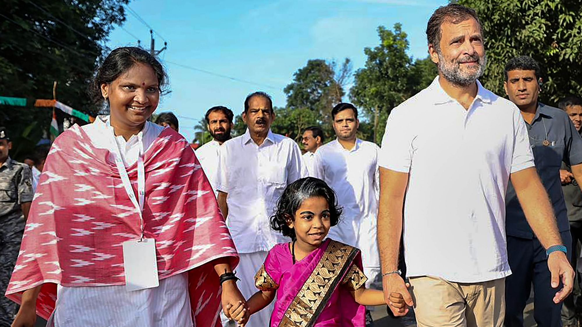<div class="paragraphs"><p>Congress MPs Rahul Gandhi and Ramya Haridas walk with a young supporter during the party's 'Bharat Jodo Yatra' in Thrissur, Kerala.</p></div>