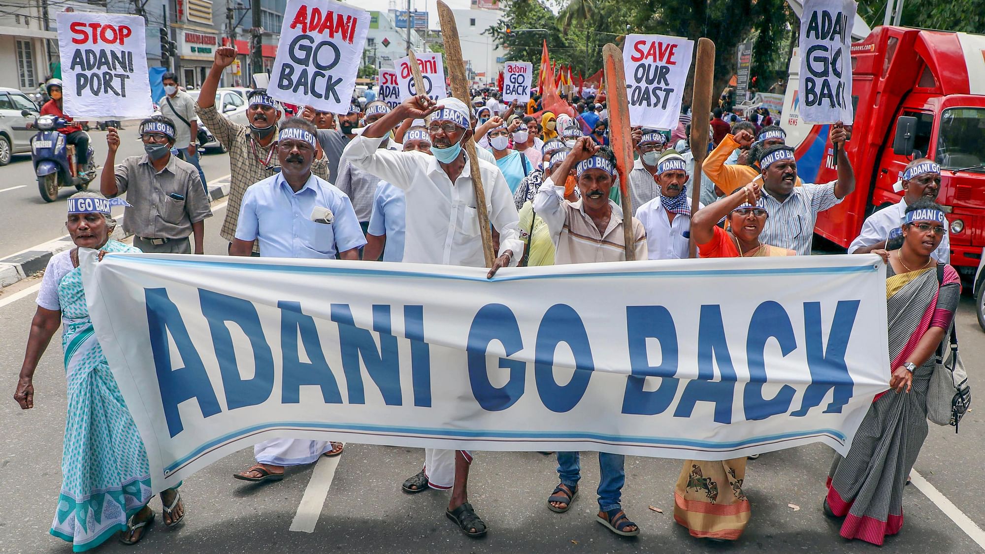 <div class="paragraphs"><p>Fishers and citizens raise slogans during their protest march towards the Kerala Secretariat, against Adani Group's port redevelopment project at Vizhinjam, in Thiruvananthapuram, Saturday, July 23, 2022.</p></div>