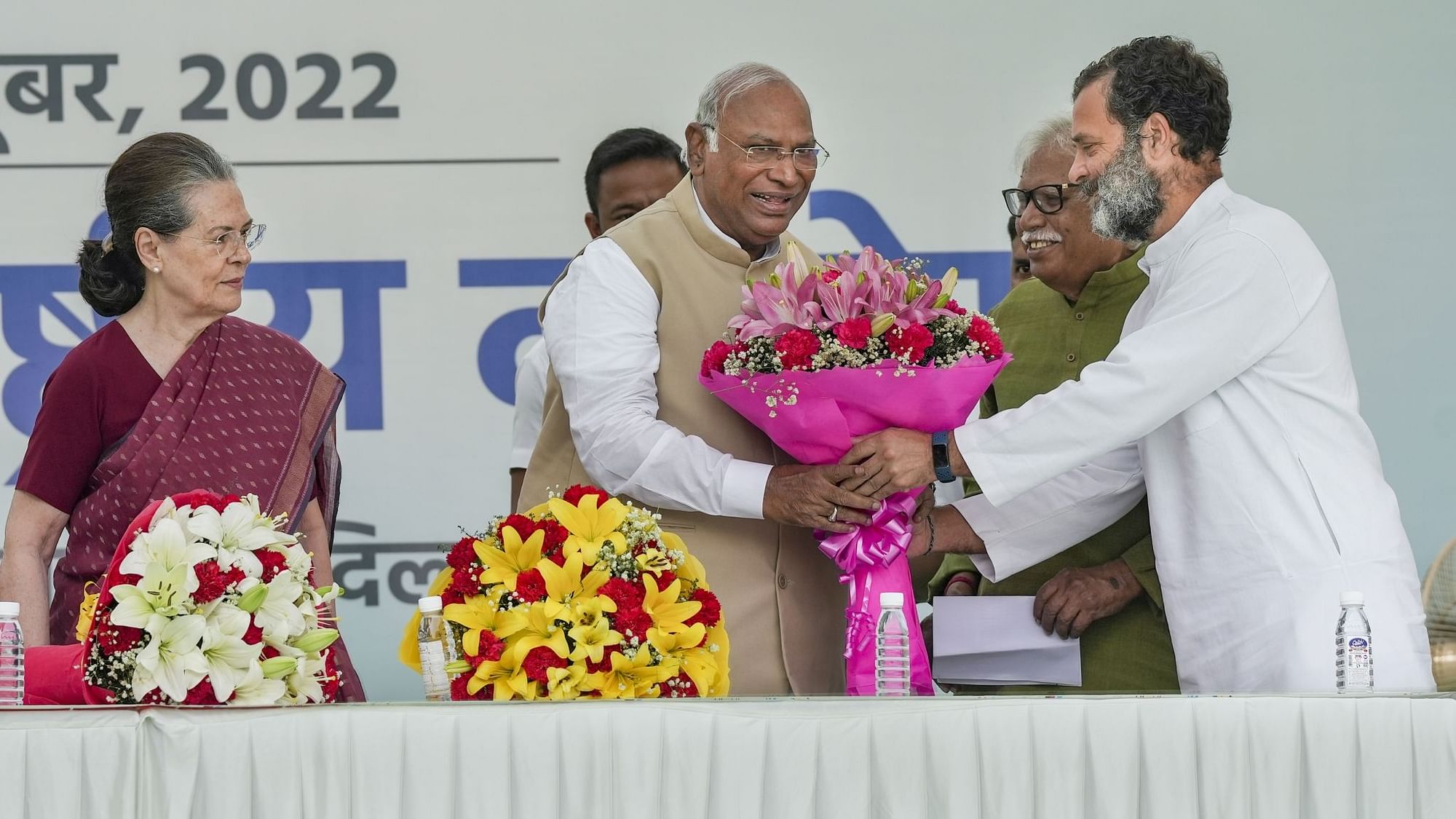 <div class="paragraphs"><p>Rahul Gandhi presenting new Congress chief Mallikarjun Kharge with a bouquet at the AICC headquarters on Wednesday, 26 October, in the presence of Sonia Gandhi.&nbsp;</p></div>