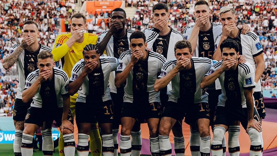<div class="paragraphs"><p>The German football team covered their mouths for their team photo captured before their World Cup opener against Japan on Wednesday, 23 November, in protest of the <a href="https://www.thequint.com/neon/gender/fifa-world-cup-qatar-becomes-field-for-gender-politics-controversies-lgbtq">FIFA's refusal to allow</a> rainbow-themed armbands.</p></div>