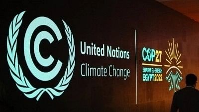 <div class="paragraphs"><p>A man walks past a board showing the 27th Conference of the Parties of the United Nations Framework Convention on Climate Change (COP27) in Sharm El-Sheikh, Egypt.</p></div>