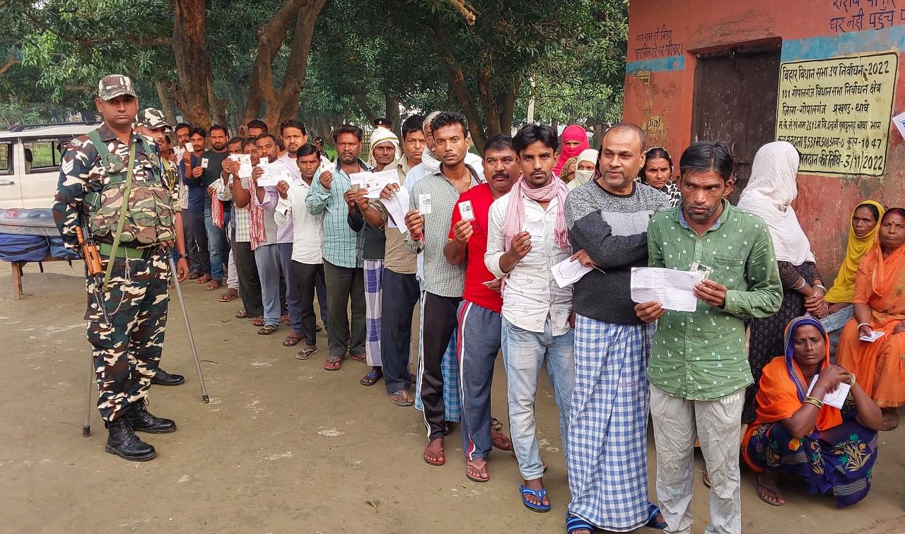 <div class="paragraphs"><p>Gopalganj: Voters holding their identification cards stand in a queue to cast their votes for the Gopalganj Assembly by-elections, in Gopalganj, Bihar, Thursday, Nov. 3, 2022.</p></div>