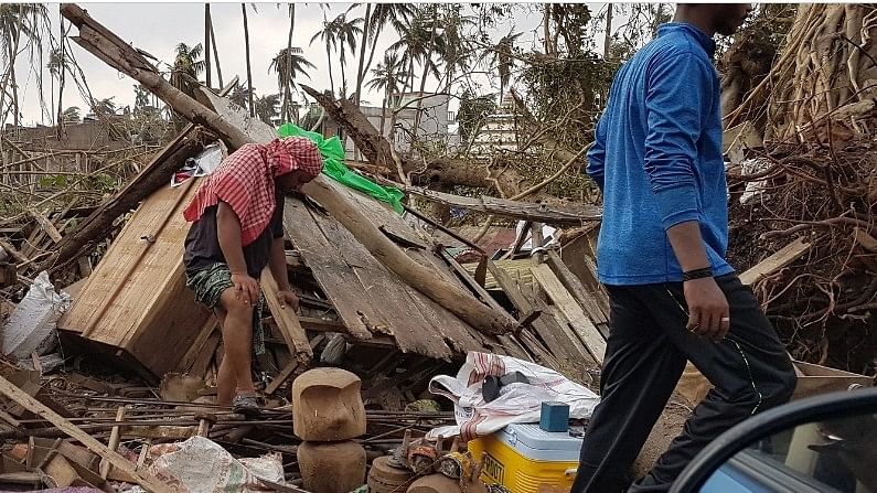 <div class="paragraphs"><p>A man looking at his damaged house on the outskirts of Puri a day after cyclone Fani hit Odisha in 2019. </p></div>