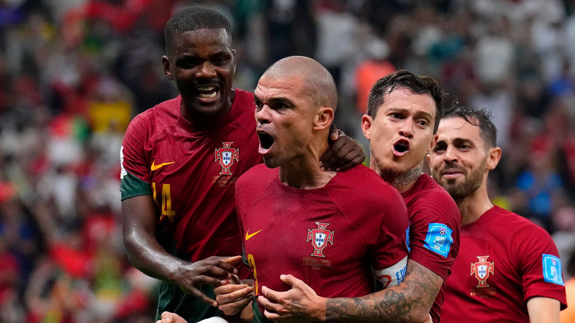 <div class="paragraphs"><p>Portugal's Pepe, middle, celebrates with teammates after scoring during the World Cup Round of 16  match against  Switzerland.</p></div>