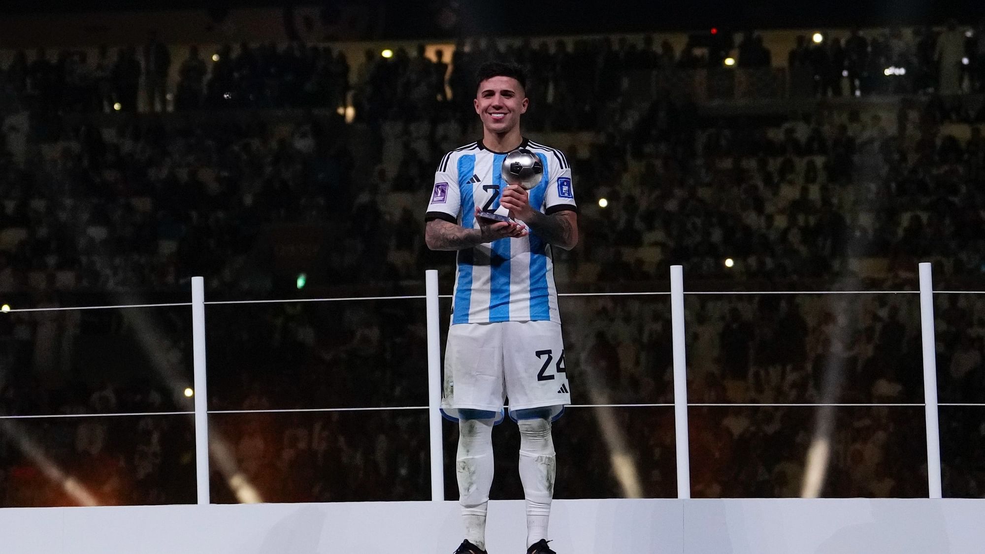 <div class="paragraphs"><p>Argentina's Enzo Fernandez poses with the Young Player award for best under 21 player of the tournament, after the World Cup final.</p></div>