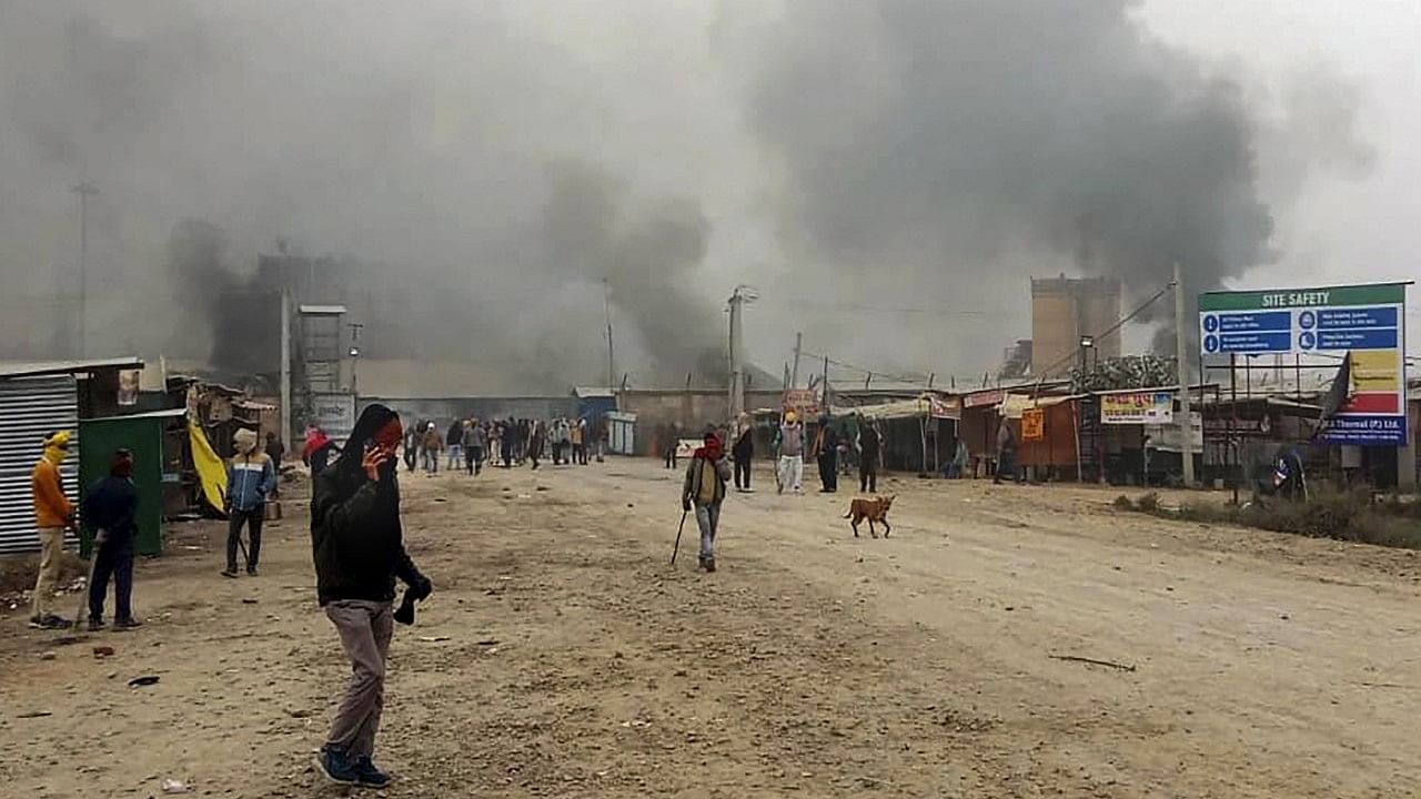 <div class="paragraphs"><p>Smoke rises after villagers torched several vehicles while agitating for proper compensation against their land acquired for a power plant, at Chausa in Buxar district.&nbsp;</p></div>